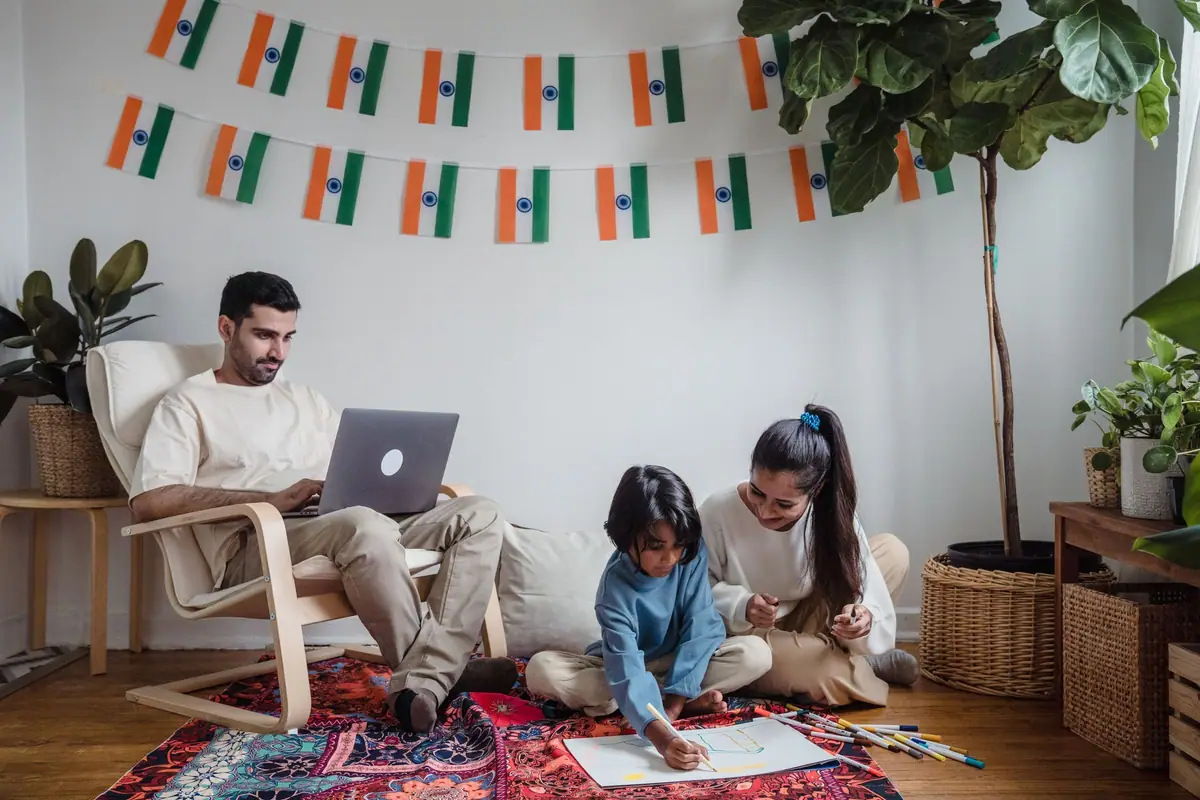 Family at home with a laptop, staying in touch