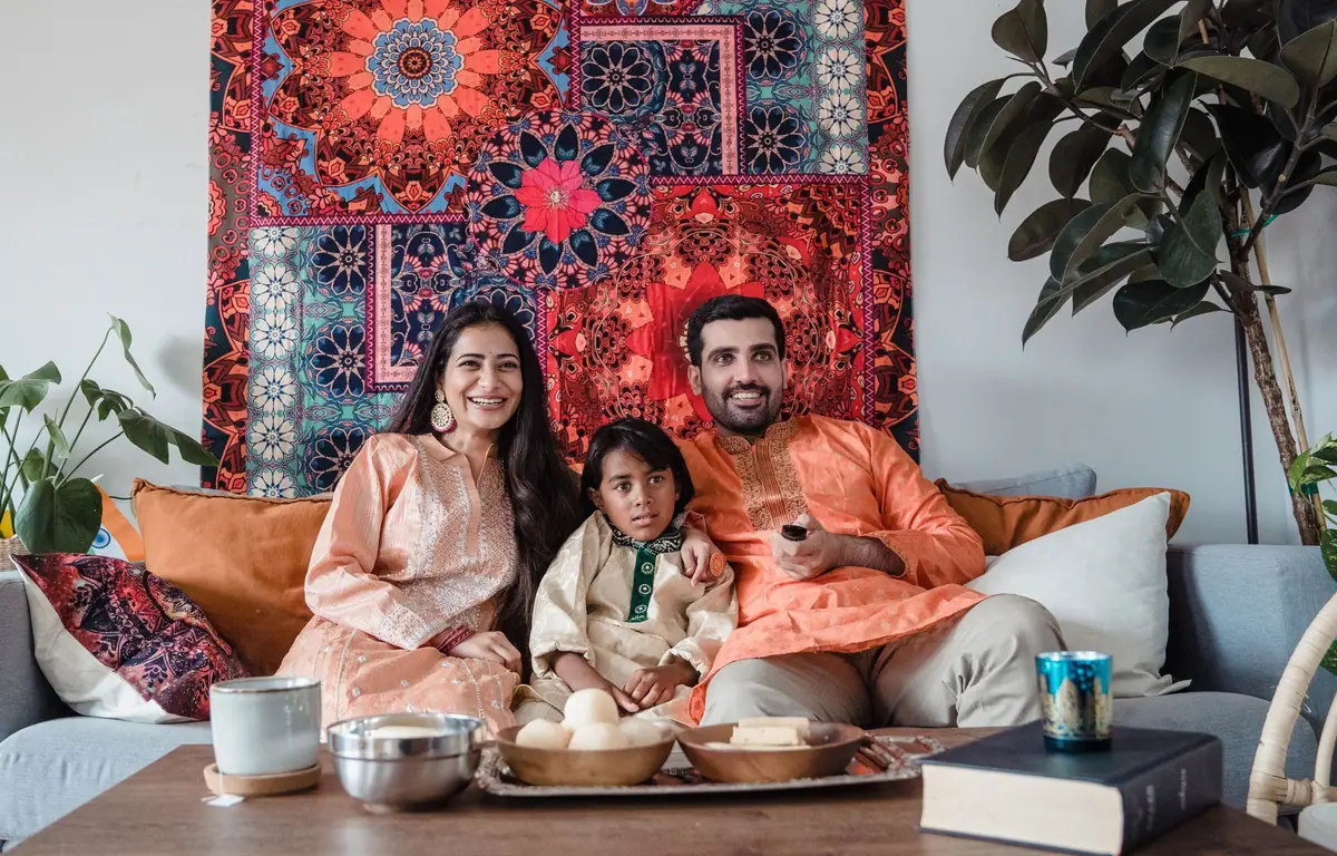 Indian family relaxing together at home