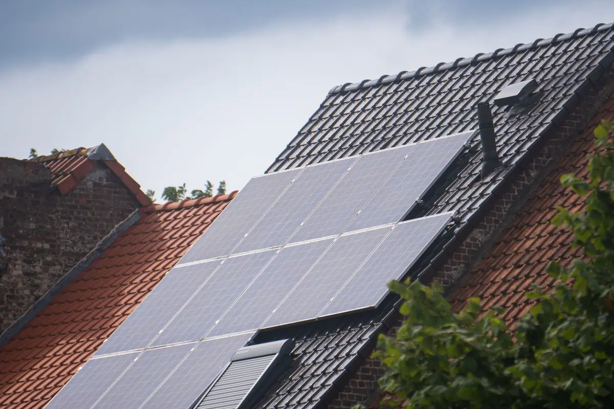 Solar panels installed on a residential tiled rooftop
