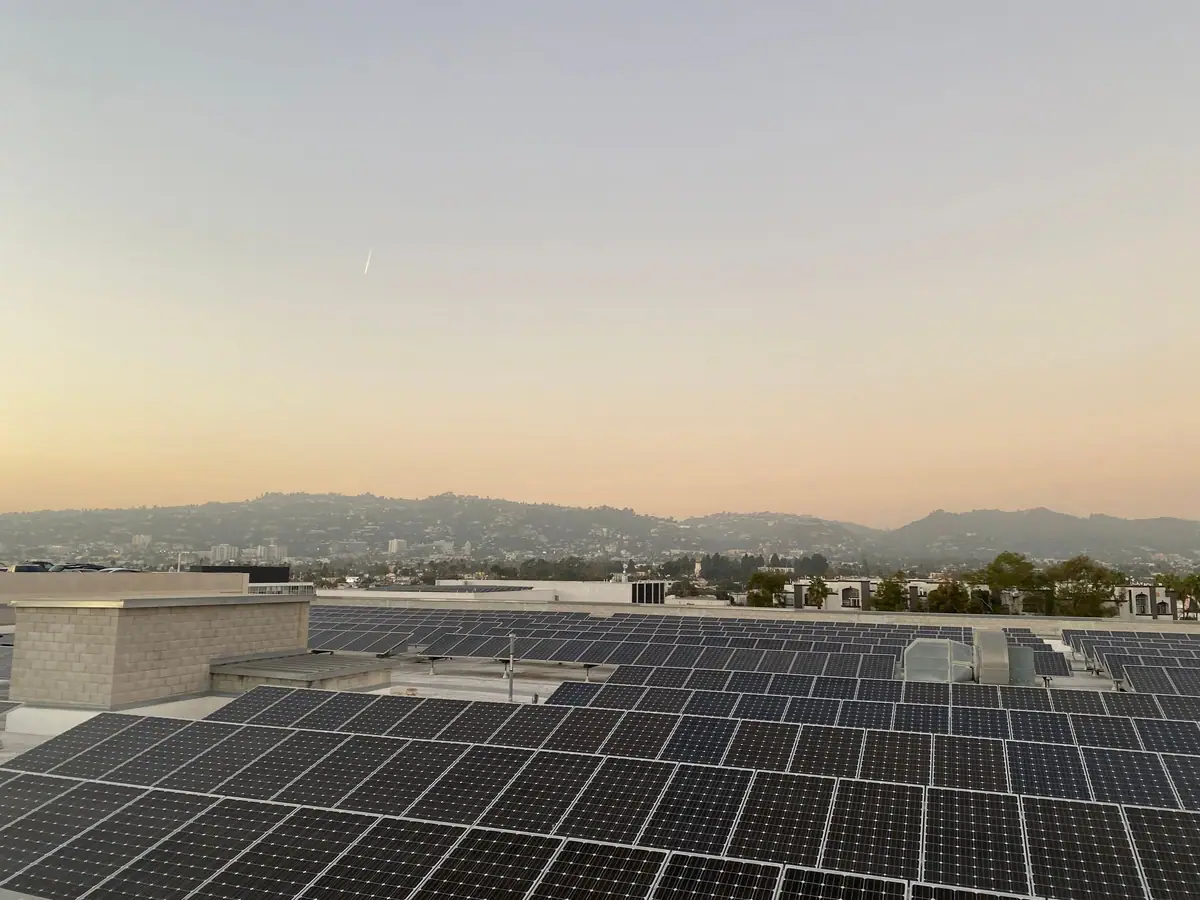 Rooftop solar array at sunset